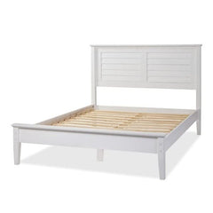 A white bed featuring wooden slats, showcasing a simple and modern design.