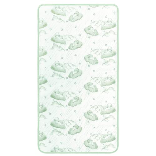 A white and green baby blanket showcasing a charming cloud motif.