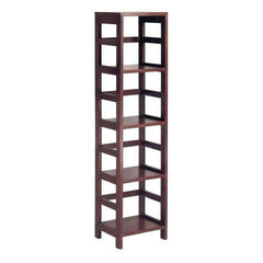 A tall bookshelf with four shelves, filled with various books and decorative items.
