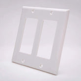 A plain white wall plate with two openings, typically used for electrical connections.