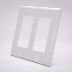 A plain white wall plate with two openings, typically used for electrical connections.