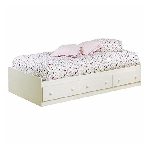 A white bed dressed in a floral patterned cover, offering a bright and cheerful aesthetic to the bedroom setting.