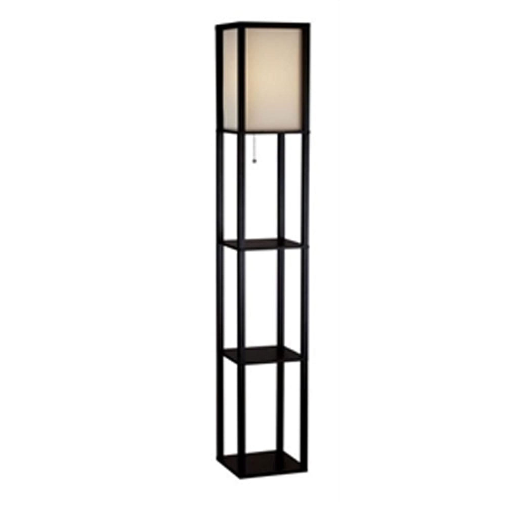 A tall black shelf featuring a lamp positioned on its top surface.