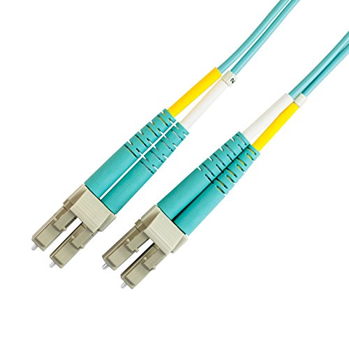 Two green and yellow fiber optic patch cables arranged side by side on a neutral background.