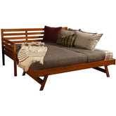 A bed featuring a sturdy wooden frame, adorned with soft pillows, offering a comfortable resting area.