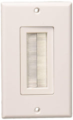 A close-up of a white wall plate with one light switch, set against a neutral wall background.