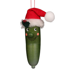 A green cucumber wearing a festive Santa hat, adding a whimsical touch to holiday decorations.