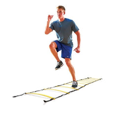 A man runs on a ladder against a plain white background, showcasing agility and balance in an unusual setting.
