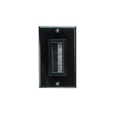 A black wall plate set on a white background, showcasing a modern aesthetic with a clear color contrast.