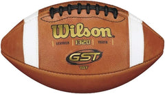 A Wilson GST football featuring a classic design with black and white panels, ideal for outdoor play and practice.