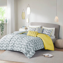 Gray and yellow comforter set featuring a modern chevron pattern in alternating colors.