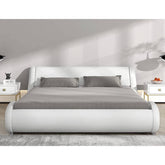 A modern white bed with a sleek grey headboard and footboard, creating a stylish focal point in the room.