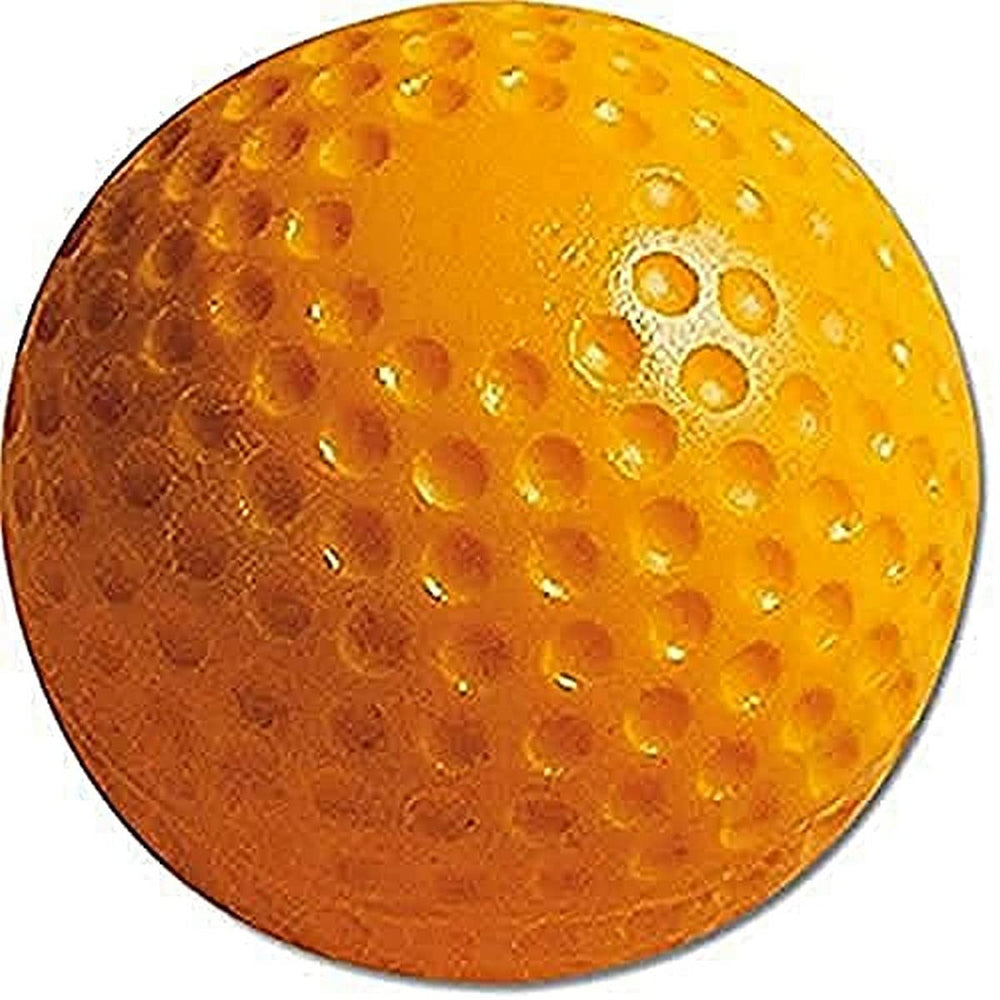 A golf ball with several holes, highlighting its unusual design and wear.