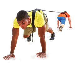 Two men engaged in push-ups against a white backdrop, demonstrating physical fitness and exercise technique.