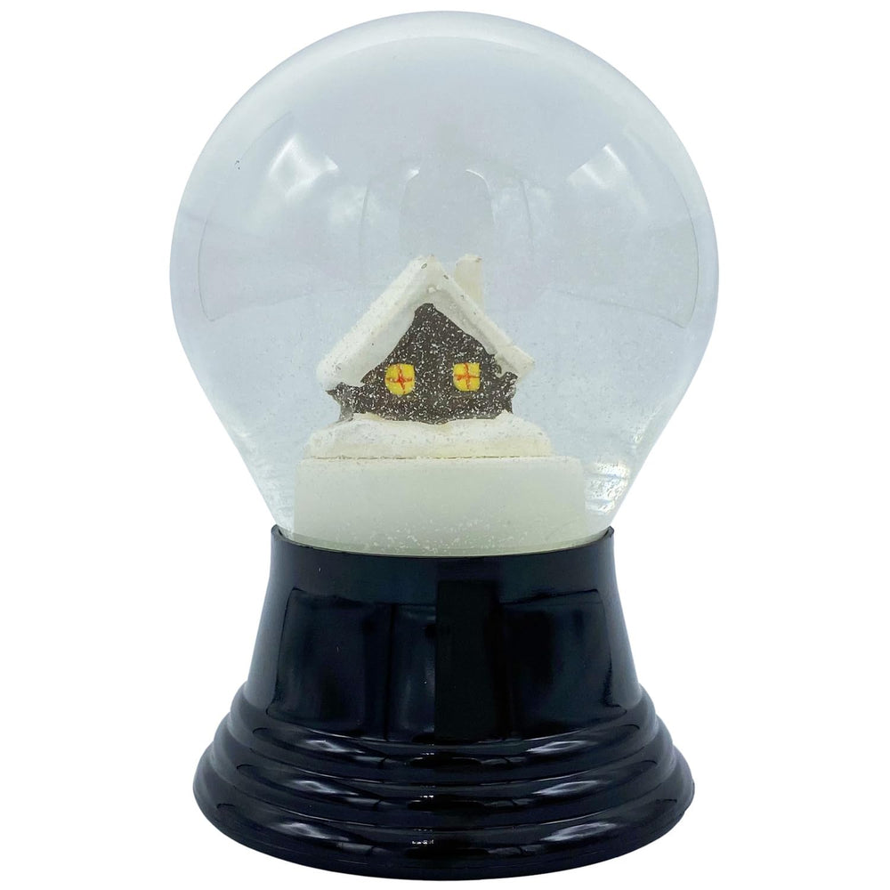A decorative snow globe containing a small house, encapsulated in a snowy environment.