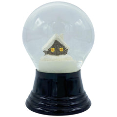 A decorative snow globe containing a small house, encapsulated in a snowy environment.