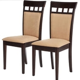 A pair of dining chairs with soft beige upholstery, showcasing a simple and elegant design.