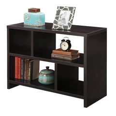 A black bookshelf filled with books and topped with a clock, adding a functional touch to the decor.