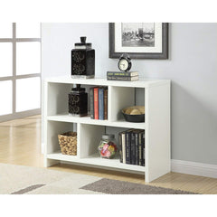 A white bookcase displaying an assortment of books and decorative objects, creating a neat and inviting atmosphere.
