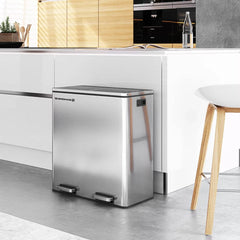 A sleek stainless steel trash can located in a tidy kitchen, complementing the contemporary decor.