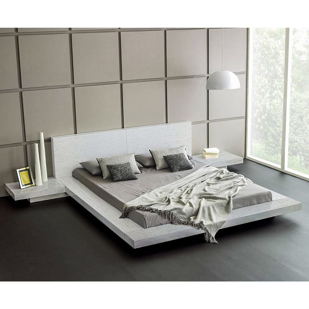 A stylish bedroom with a white bed and gray walls, showcasing a modern and minimalist design aesthetic.