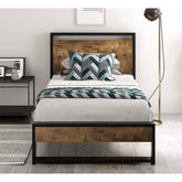 A bed featuring a sturdy wooden frame, topped with a decorative bedspread, inviting a restful night's sleep.