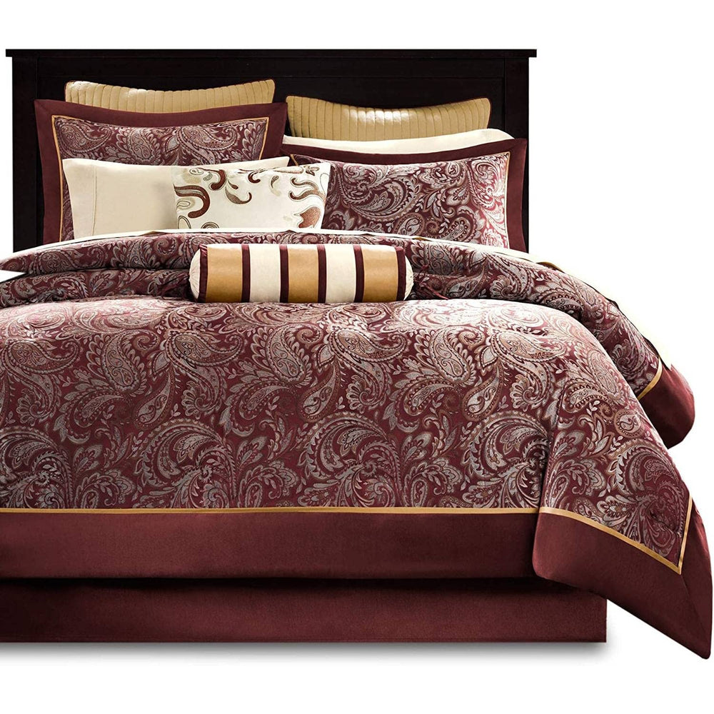 Maroon comforter set featuring elegant gold accents, showcasing a rich color contrast and luxurious design.