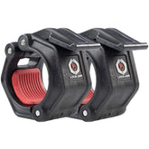 Two black and red clamps featuring a prominent red handle, positioned side by side on a neutral background.