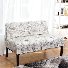 A stylish white couch with a sleek black frame and a plush white fabric covering, perfect for contemporary interiors.