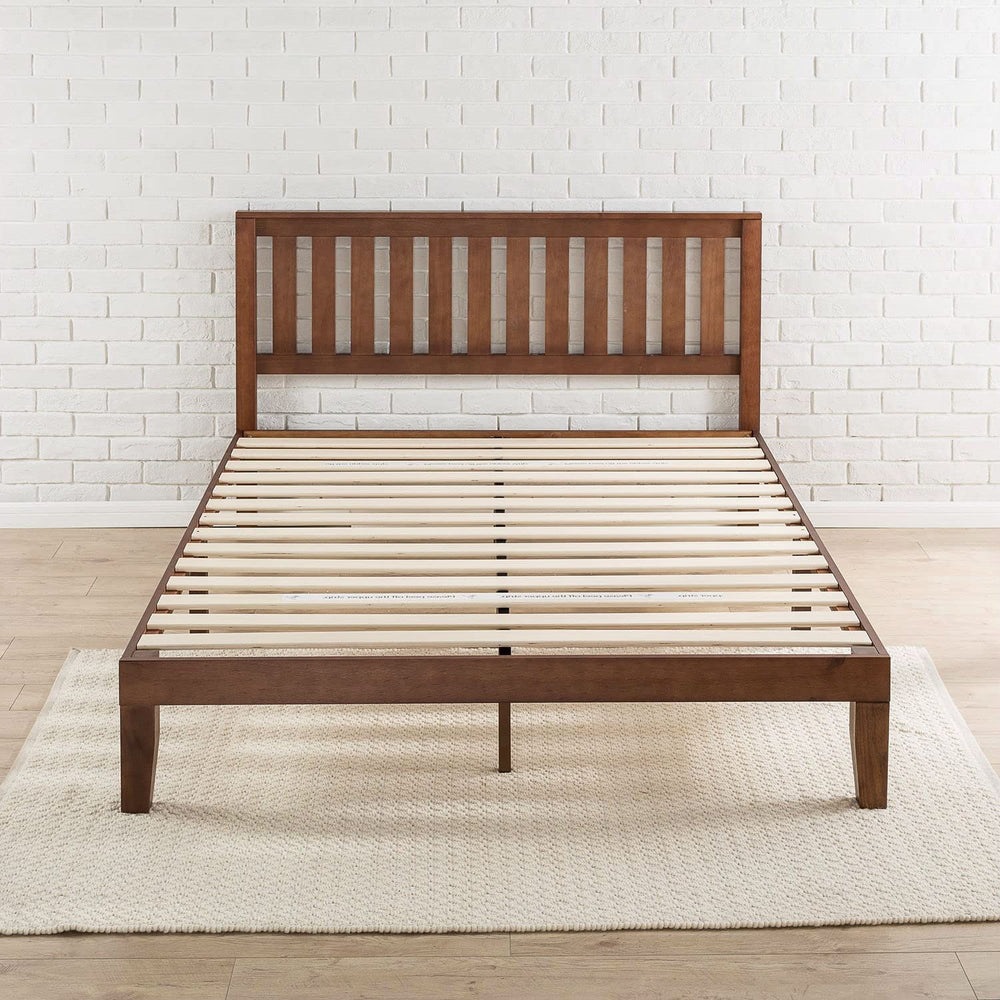 A wooden bed frame featuring slats and a matching headboard, showcasing a natural finish and sturdy design.