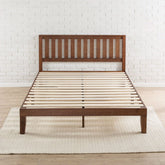 A wooden bed frame featuring slats and a matching headboard, showcasing a natural finish and sturdy design.