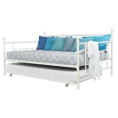 A stylish white metal day bed featuring plush blue pillows, perfect for a cozy bedroom setting.