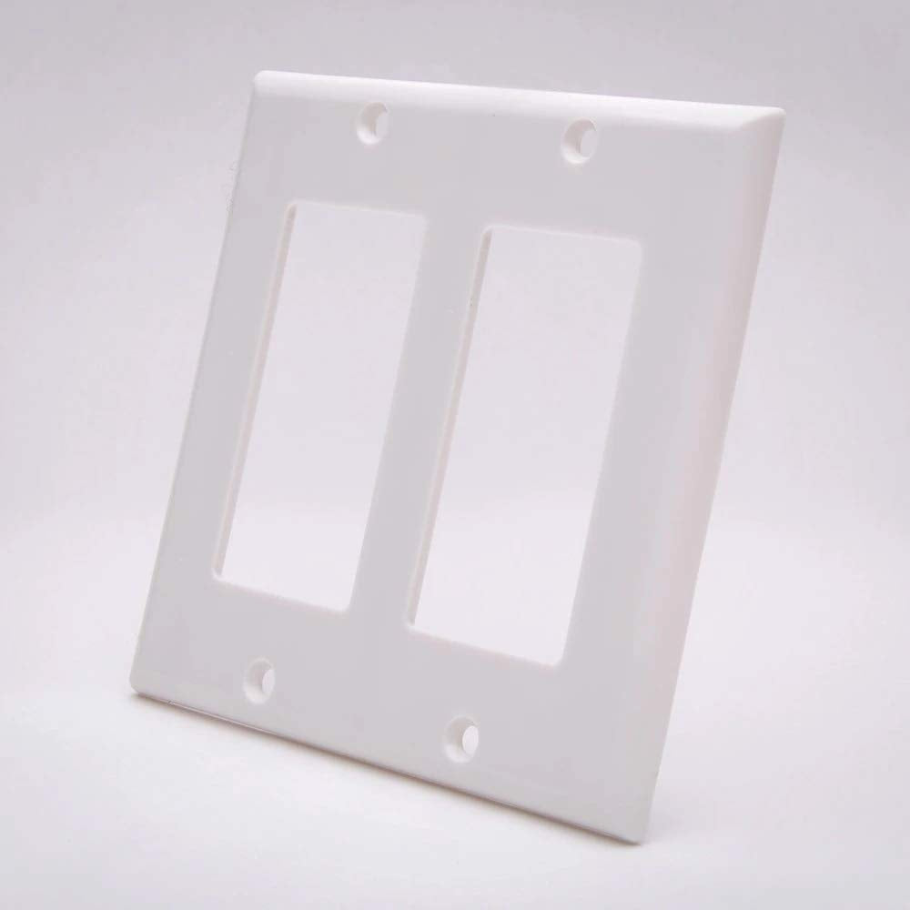 A plain white wall plate with two openings, typically used for electrical connections.