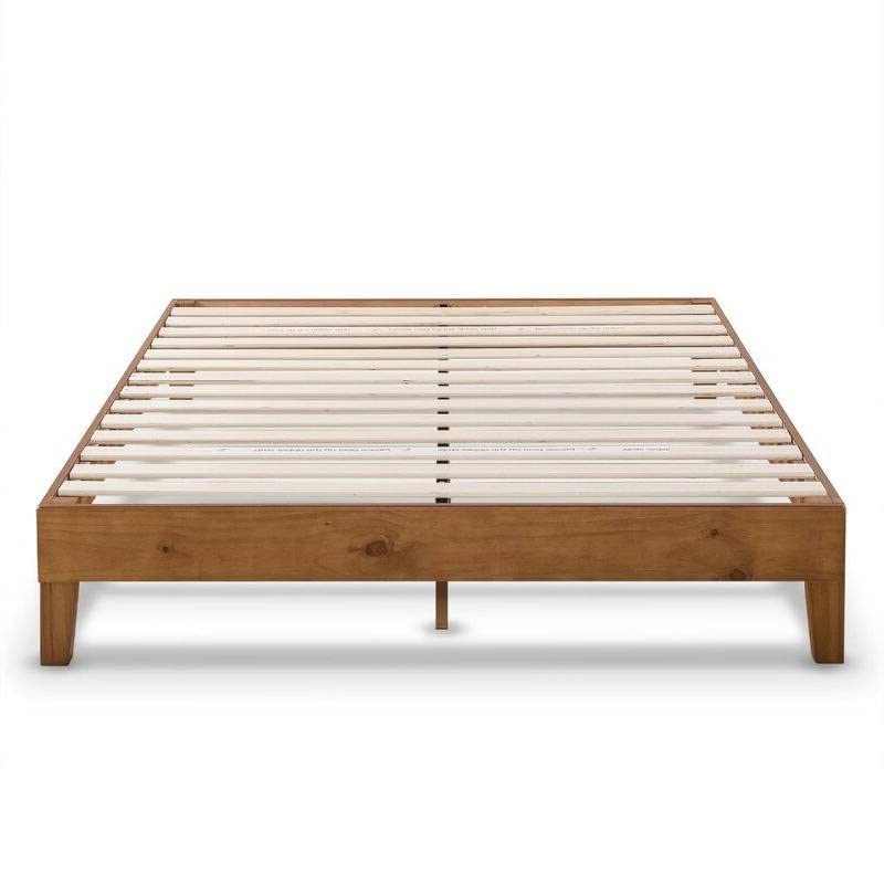 A bed frame constructed with wooden slats, designed to provide sturdy support for a mattress.
