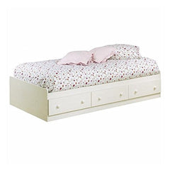 A white bed dressed in a floral patterned cover, offering a bright and cheerful aesthetic to the bedroom setting.