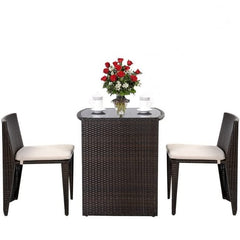 A three-piece outdoor patio set with two comfortable chairs and a matching table for enjoying the outdoors.
