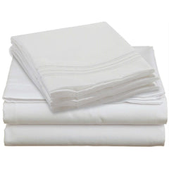 A neatly stacked pile of white sheets resting on a white surface, emphasizing simplicity and uniformity.