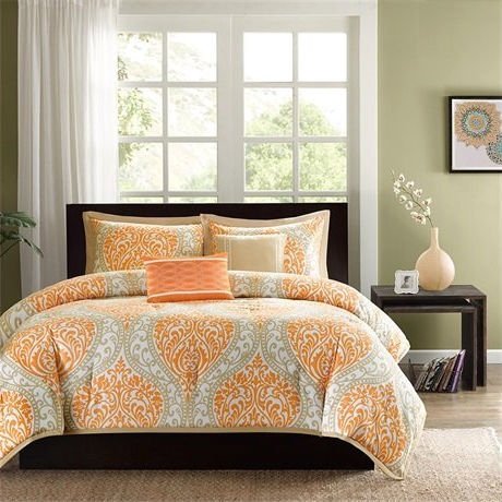Orange and gray comforter set displayed on a neatly made bed, showcasing its vibrant colors and modern design.