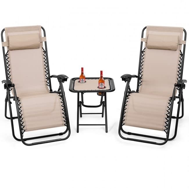 A pair of reclining chairs with a small table featuring a bottle of wine, perfect for a leisurely evening.