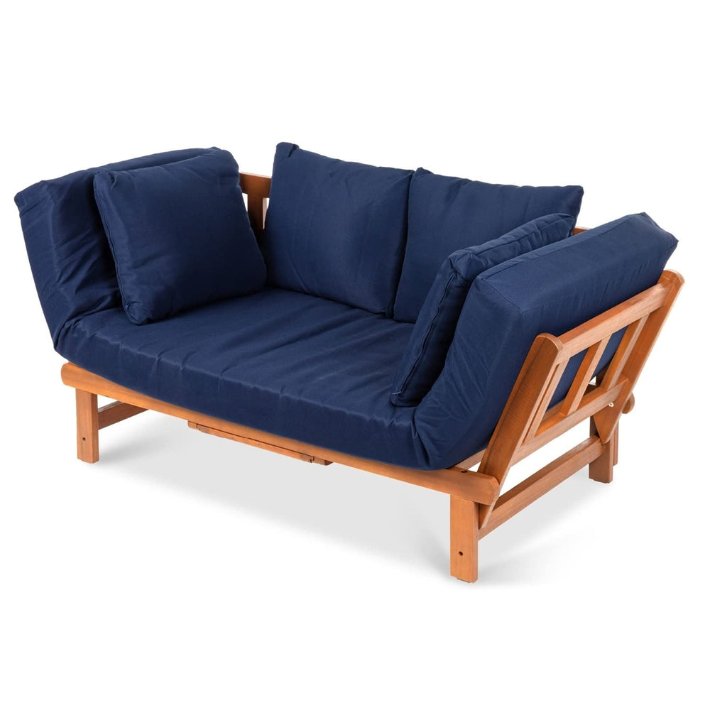 A wooden futon featuring soft blue cushions, set in a warm and inviting room.