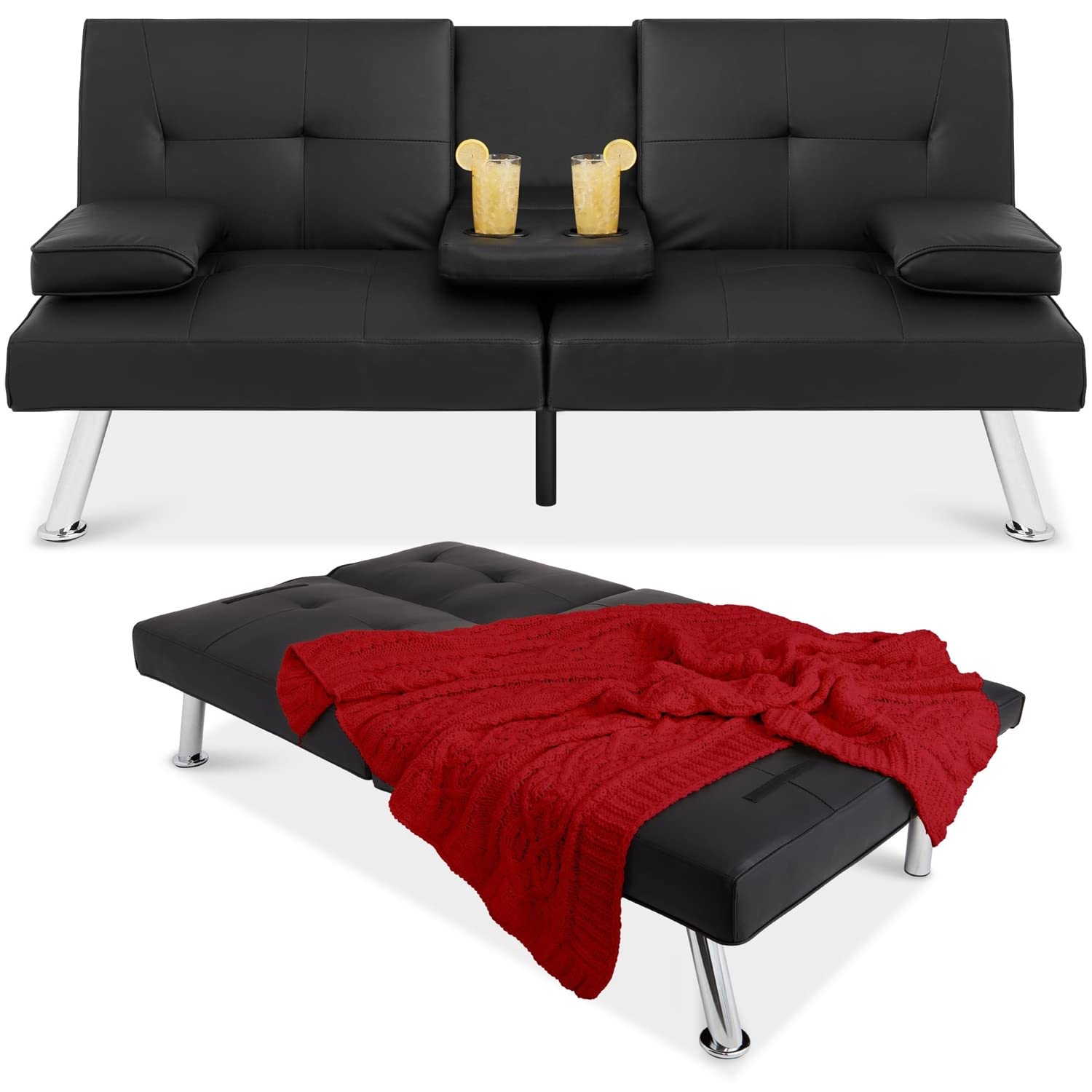 A stylish black leather couch with a warm red blanket resting on its side.