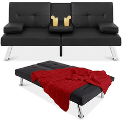 A stylish black leather couch with a warm red blanket resting on its side.