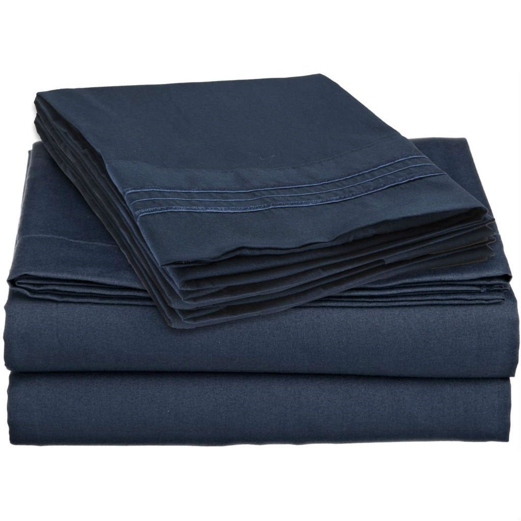  A pile of navy blue sheets with a smooth, folded edge, arranged neatly.