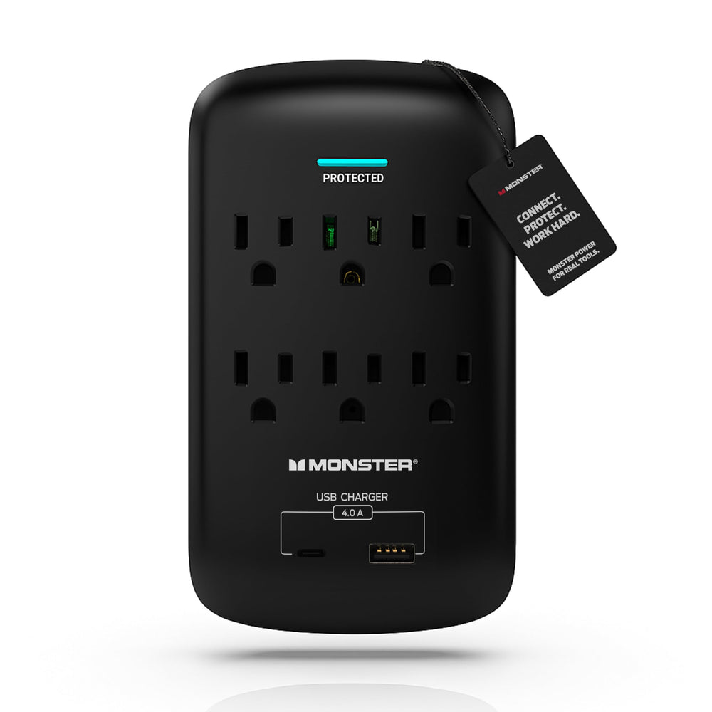 The monster charger is plugged into a wall outlet, indicating it is charging a device.
