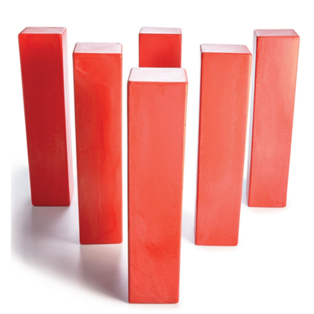 A cluster of red blocks arranged on a clean white surface.