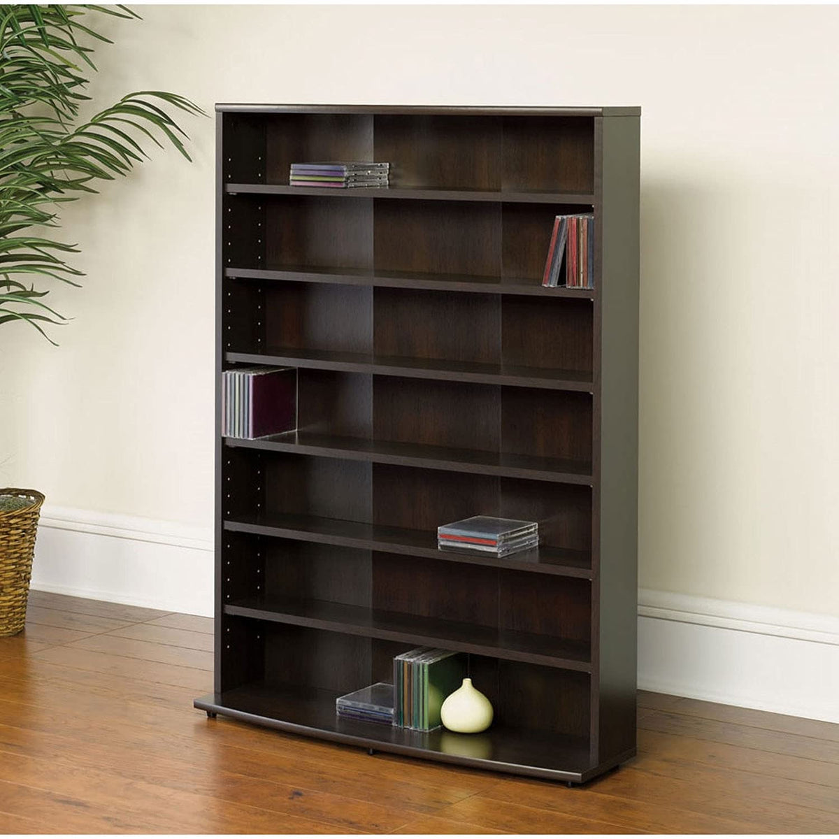 A spacious black bookcase with multiple shelves, designed to hold books and other decorative objects.