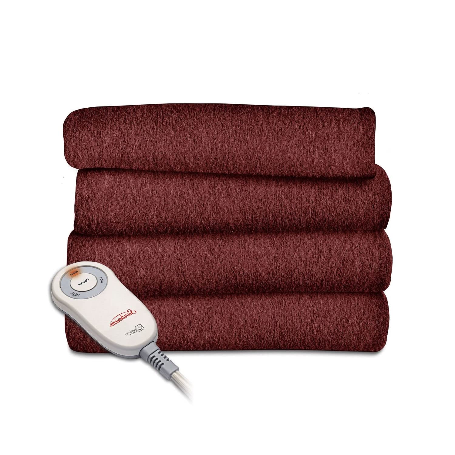 A cozy arrangement of four red blankets stacked with a remote control placed on the top blanket.