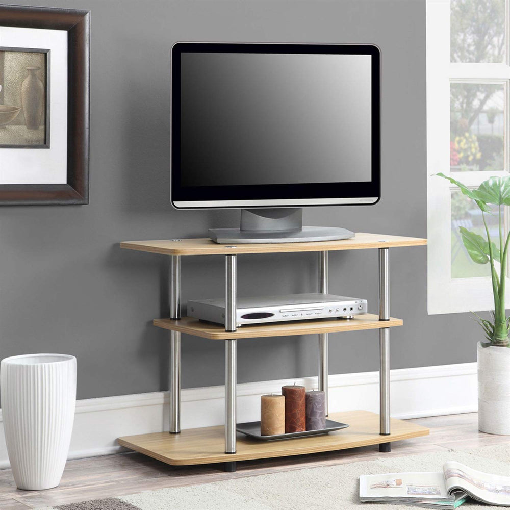 A sleek TV stand with a flat screen TV on top and a lower shelf for additional storage or decorative objects.