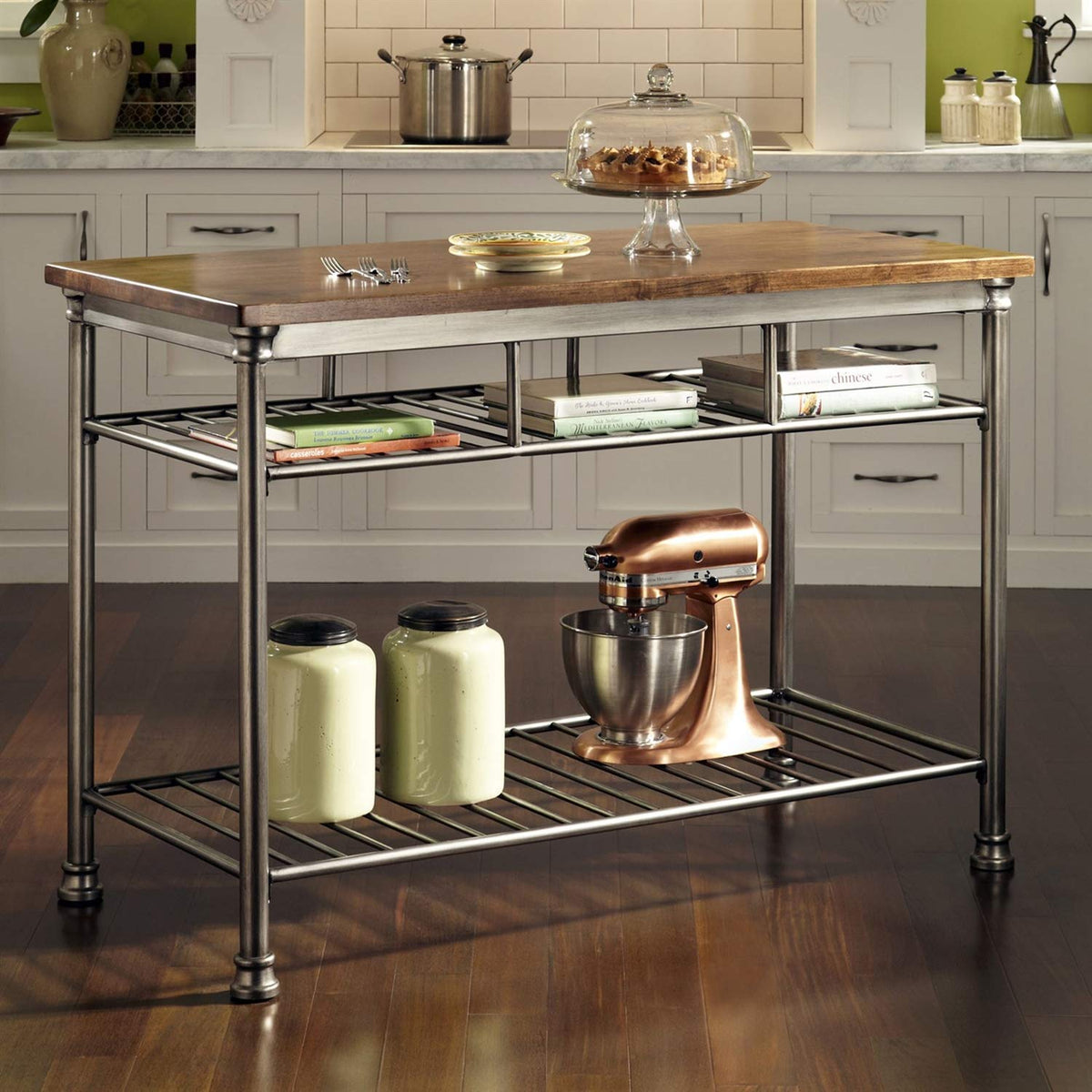A kitchen island equipped with a mixer and assorted utensils, showcasing a functional cooking space.