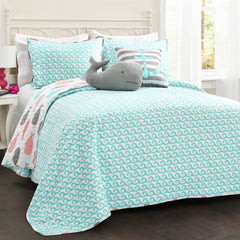 A neatly made bed adorned with a soft, oversized whale toy, adding a touch of charm to the bedroom decor.